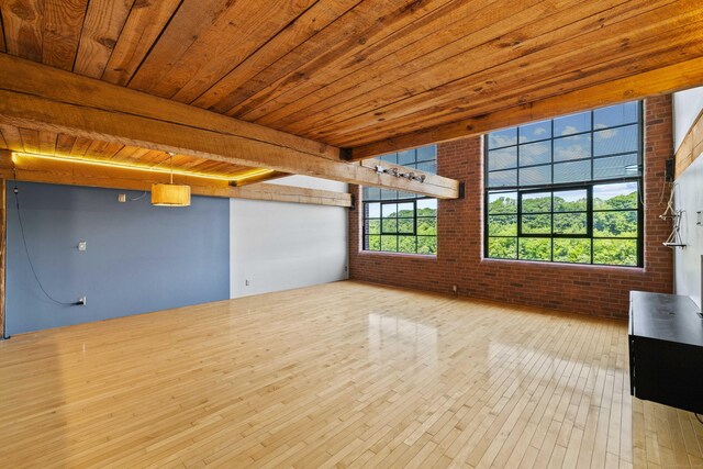 68 Thermos Ave Unit 302D, Norwich, CT 06360 - unfurnished room with brick wall, wood-type flooring, and wood ceiling