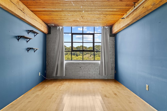 68 Thermos Ave Unit 302D, Norwich, CT 06360 - empty room featuring wooden ceiling, wood-type flooring, and brick wall