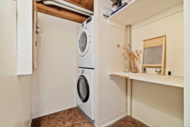 68 Thermos Ave Unit 302D, Norwich, CT 06360 - laundry area with stacked washing machine and dryer and baseboards