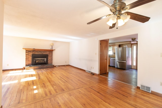 26 Hunt Ln, East Haven, CT 06512 - unfurnished living room featuring hardwood / wood-style floors, ceiling fan, and a fireplace