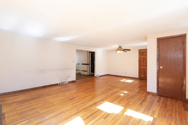 26 Hunt Ln, East Haven, CT 06512 - empty room with light wood-type flooring and ceiling fan
