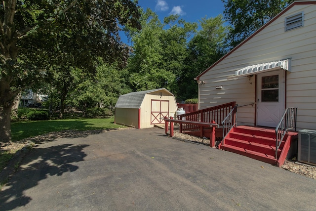 26 Hunt Ln, East Haven, CT 06512 - view of patio featuring a storage shed