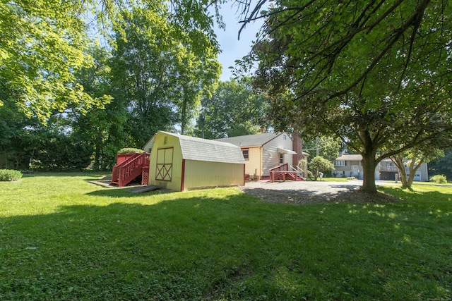 26 Hunt Ln, East Haven, CT 06512 - view of green lawn with a storage shed