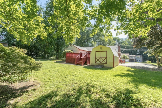 26 Hunt Ln, East Haven, CT 06512 - view of green lawn featuring a storage unit and a wooden deck