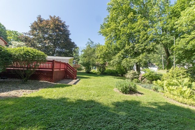 26 Hunt Ln, East Haven, CT 06512 - view of green lawn with a deck and stairway
