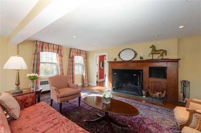 300 Ridgefield Rd, Wilton, CT 06897 - living room featuring radiator heating unit, a fireplace, wood finished floors, and recessed lighting