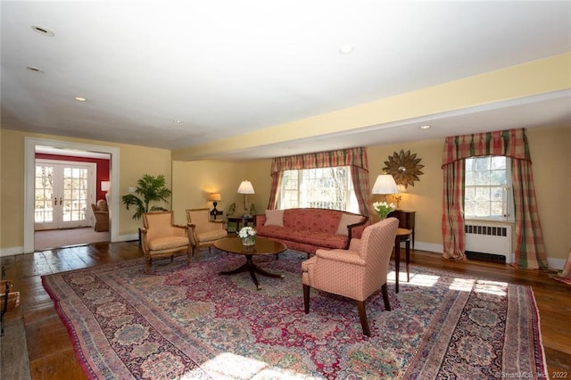 300 Ridgefield Rd, Wilton, CT 06897 - living room featuring radiator heating unit, hardwood / wood-style flooring, recessed lighting, and french doors