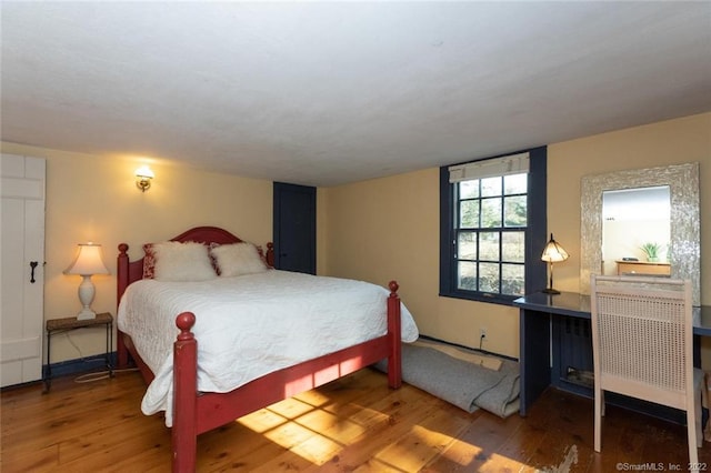 300 Ridgefield Rd, Wilton, CT 06897 - bedroom with wood finished floors and radiator