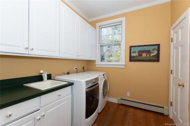 300 Ridgefield Rd, Wilton, CT 06897 - laundry room with a baseboard heating unit, cabinet space, washer and clothes dryer, dark wood finished floors, and crown molding