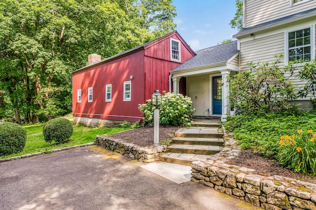 300 Ridgefield Rd, Wilton, CT 06897 - view of front of home with a chimney and roof with shingles