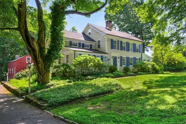 300 Ridgefield Rd, Wilton, CT 06897 - colonial house with a chimney and a front lawn