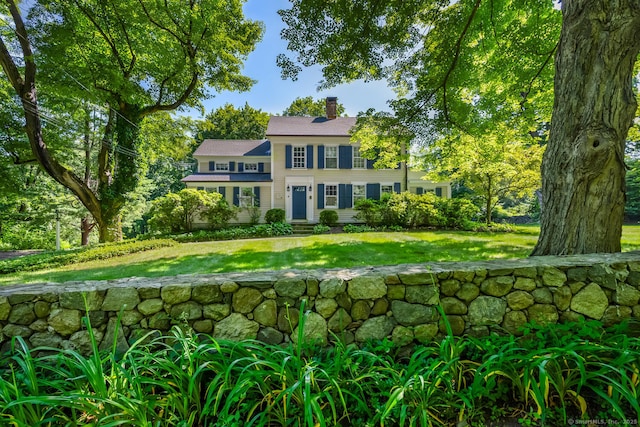 300 Ridgefield Rd, Wilton, CT 06897 - view of front facade featuring a chimney and a front lawn