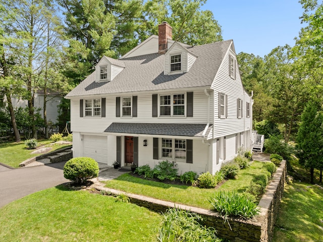 28 Great Hill Rd, Darien, CT 06820 - view of front facade featuring a chimney, roof with shingles, driveway, an attached garage, and a front lawn