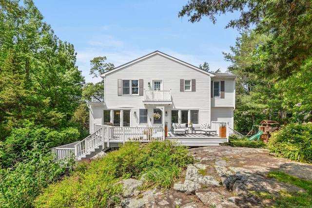 28 Great Hill Rd, Darien, CT 06820 - rear view of house with a balcony, a playground, and a wooden deck