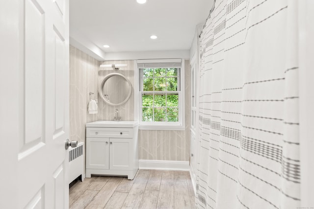 28 Great Hill Rd, Darien, CT 06820 - laundry area with light wood-style flooring, recessed lighting, and radiator heating unit
