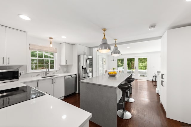 28 Great Hill Rd, Darien, CT 06820 - kitchen featuring appliances with stainless steel finishes, healthy amount of natural light, a center island, light countertops, and recessed lighting