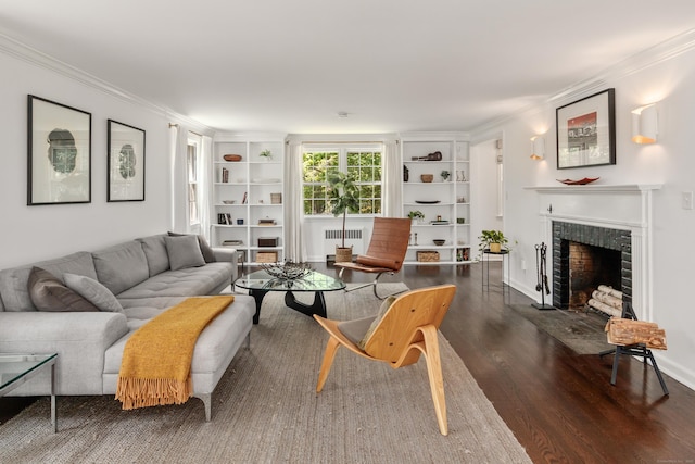 28 Great Hill Rd, Darien, CT 06820 - living area with radiator, ornamental molding, wood finished floors, a fireplace with raised hearth, and built in features