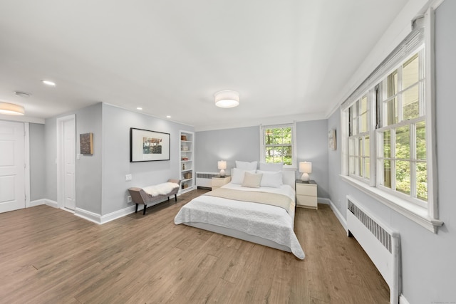 28 Great Hill Rd, Darien, CT 06820 - bedroom with radiator heating unit, wood finished floors, and recessed lighting