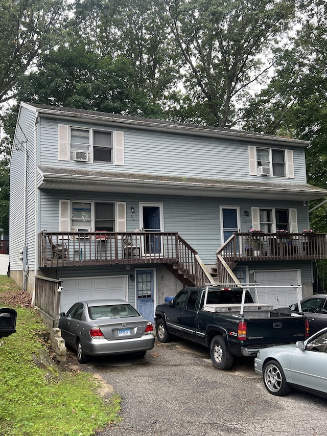 58 Milne Ave, Shelton, CT 06484 - view of front of house featuring an attached garage, stairway, and driveway