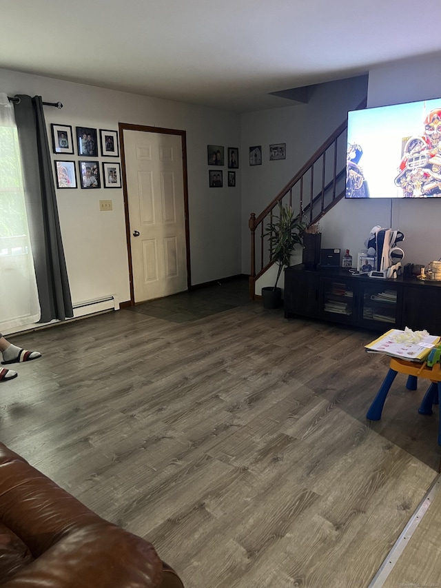 58 Milne Ave, Shelton, CT 06484 - living room featuring wood finished floors, a baseboard radiator, and stairway