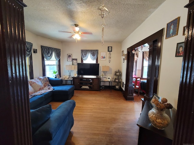 73 Newfield Ave, Bridgeport, CT 06607 - living area featuring a textured ceiling, a ceiling fan, and wood finished floors