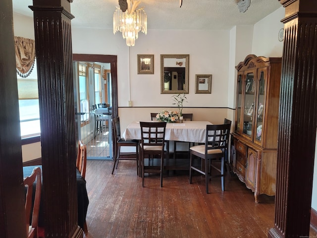 73 Newfield Ave, Bridgeport, CT 06607 - dining space with hardwood / wood-style flooring, a chandelier, and a textured ceiling