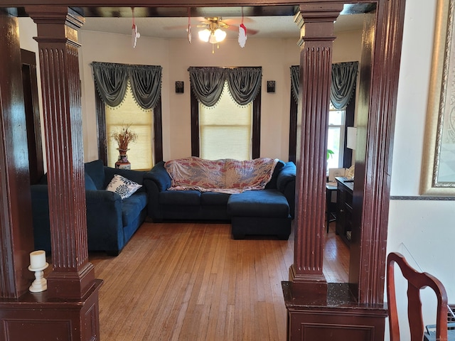 73 Newfield Ave, Bridgeport, CT 06607 - living room featuring ornate columns, light wood-type flooring, and ceiling fan
