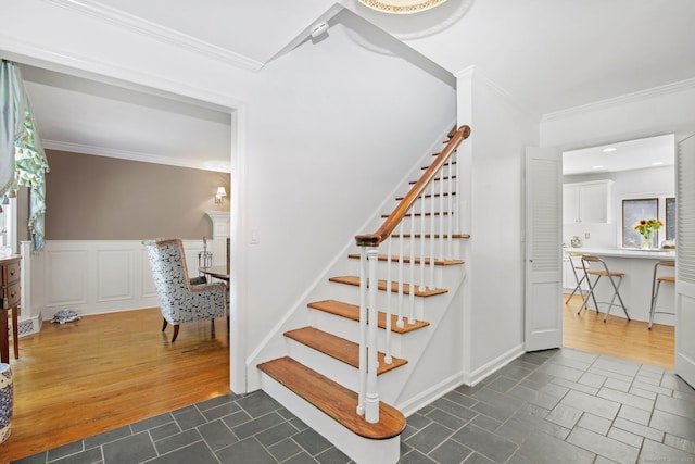 63 Pipers Hill Rd, Wilton, CT 06897 - stairway featuring crown molding, plenty of natural light, and a wainscoted wall