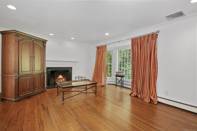 63 Pipers Hill Rd, Wilton, CT 06897 - living area with wood finished floors, a lit fireplace, baseboard heating, recessed lighting, and crown molding