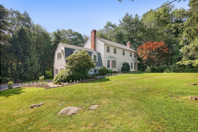63 Pipers Hill Rd, Wilton, CT 06897 - view of front of property featuring a chimney, a gambrel roof, and a front lawn