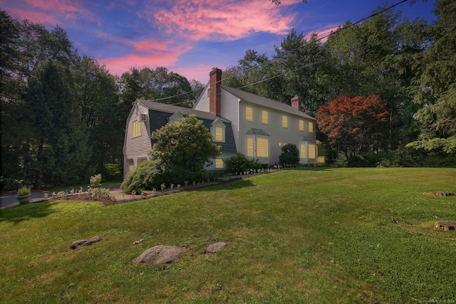 63 Pipers Hill Rd, Wilton, CT 06897 - view of front facade featuring a chimney, a gambrel roof, and a lawn