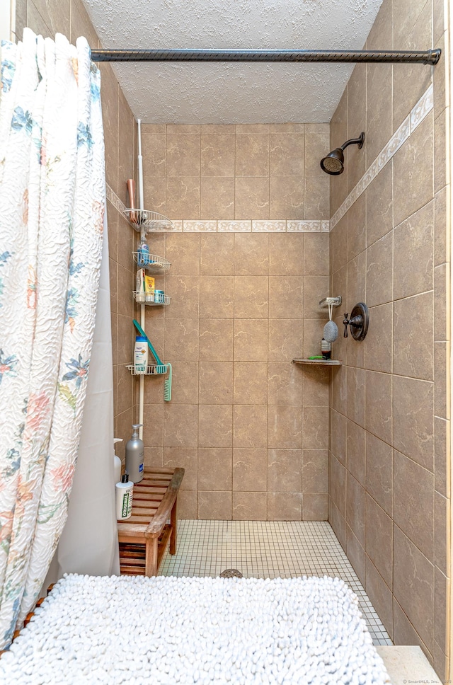 80 Richard Ave, Wolcott, CT 06716 - bathroom with a tile shower and a textured ceiling