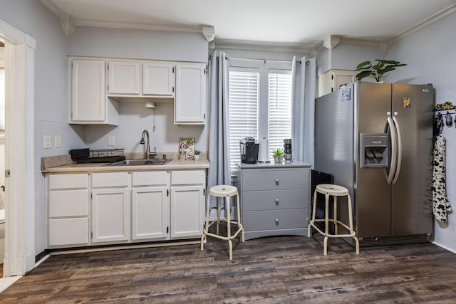 38 Florence St, Manchester, CT 06040 - kitchen with stainless steel fridge with ice dispenser, crown molding, dark wood-style flooring, white cabinetry, and light countertops