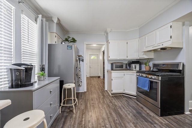 38 Florence St, Manchester, CT 06040 - kitchen featuring stainless steel appliances, ornamental molding, dark wood-style flooring, white cabinets, and light countertops