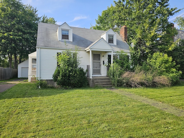 120 Nilan St, Hartford, CT 06106 - new england style home with a front lawn, an outdoor structure, a chimney, and a garage