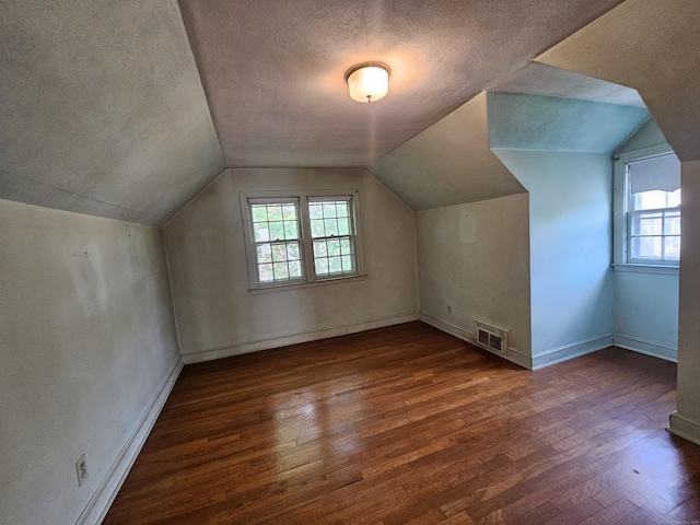 120 Nilan St, Hartford, CT 06106 - additional living space featuring a textured ceiling, wood finished floors, and lofted ceiling
