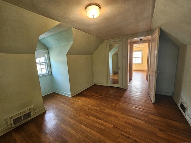 120 Nilan St, Hartford, CT 06106 - bonus room featuring dark wood-style floors, a textured ceiling, and vaulted ceiling