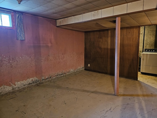 120 Nilan St, Hartford, CT 06106 - basement with washer / dryer, wooden walls, tile patterned floors, and a drop ceiling