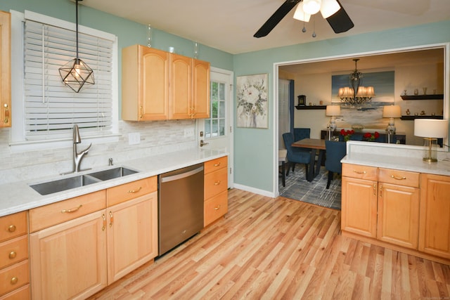 157 Windy Dr, Wolcott, CT 06705 - kitchen with dishwasher, light wood-type flooring, light brown cabinetry, backsplash, and light countertops