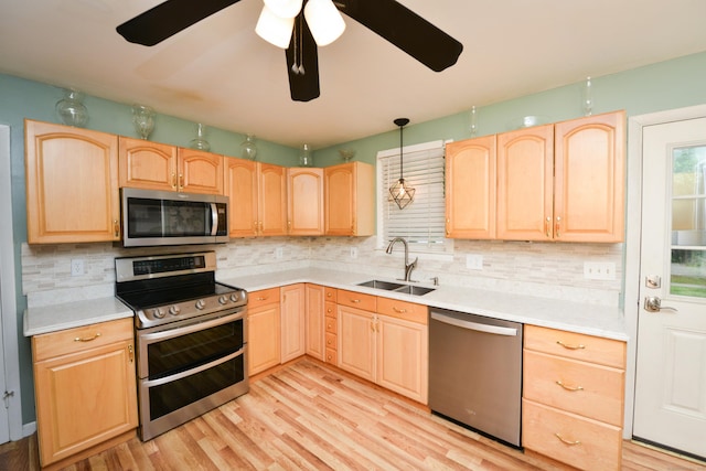 157 Windy Dr, Wolcott, CT 06705 - kitchen with stainless steel appliances, light brown cabinets, and backsplash