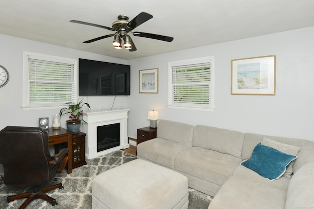 157 Windy Dr, Wolcott, CT 06705 - living area featuring plenty of natural light, ceiling fan, a fireplace, and wood finished floors
