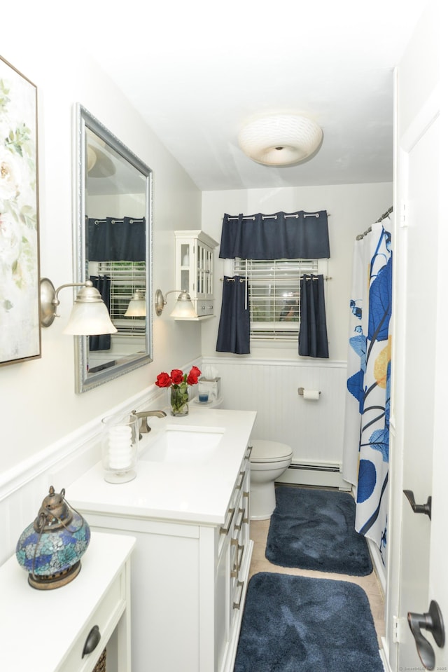 157 Windy Dr, Wolcott, CT 06705 - bathroom with a baseboard radiator, vanity, a wainscoted wall, and curtained shower