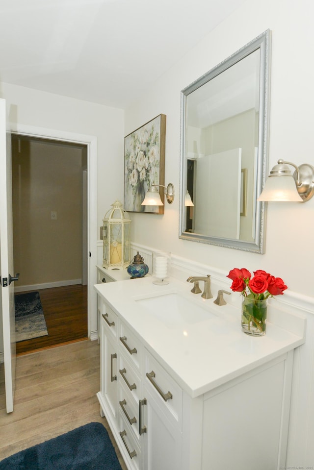 157 Windy Dr, Wolcott, CT 06705 - bathroom featuring vanity, wood finished floors, and wainscoting