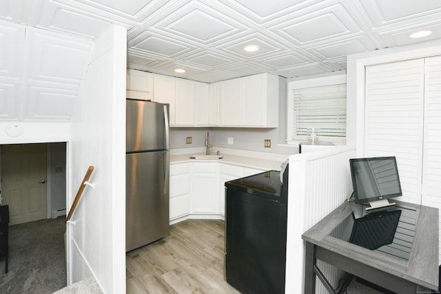 157 Windy Dr, Wolcott, CT 06705 - kitchen featuring freestanding refrigerator, an ornate ceiling, light countertops, white cabinets, and light wood-type flooring