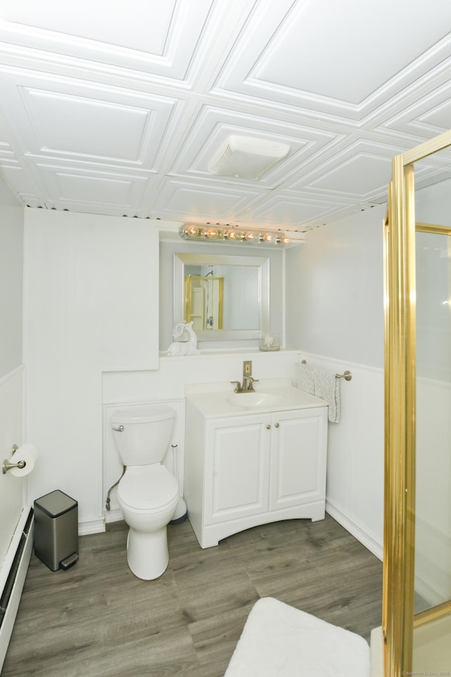 157 Windy Dr, Wolcott, CT 06705 - bathroom with a baseboard radiator, vanity, wainscoting, and wood finished floors