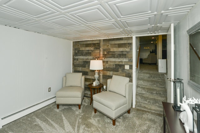 157 Windy Dr, Wolcott, CT 06705 - living area with a baseboard heating unit, carpet flooring, wooden walls, and an ornate ceiling