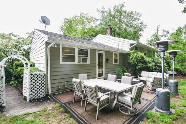 157 Windy Dr, Wolcott, CT 06705 - back of property featuring outdoor lounge area, a chimney, outdoor dining area, a patio area, and roof with shingles