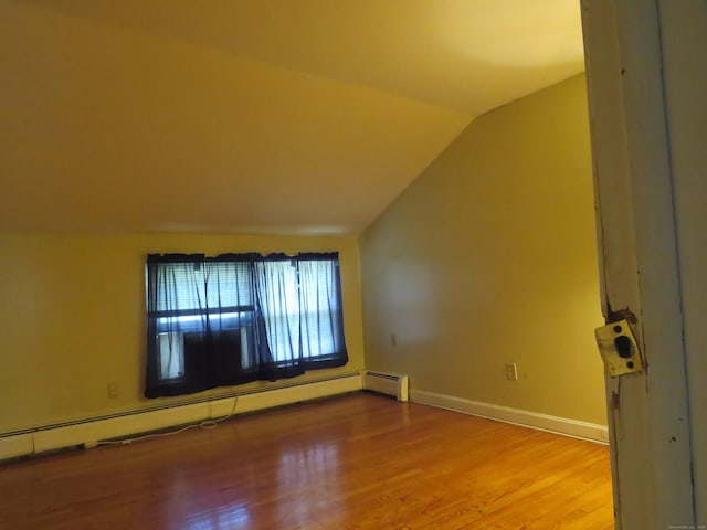 19 Cardston Cir, Windsor, CT 06095 - additional living space featuring a baseboard heating unit, lofted ceiling, and wood finished floors