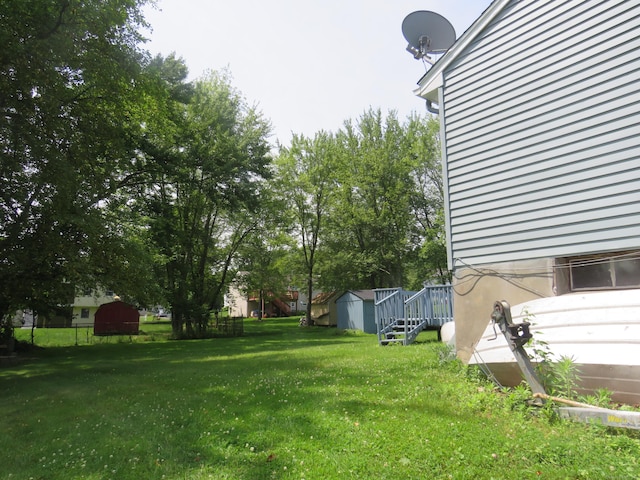 19 Cardston Cir, Windsor, CT 06095 - view of grassy yard featuring a shed