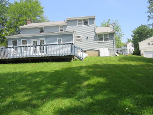 19 Cardston Cir, Windsor, CT 06095 - back of property featuring a chimney, a wooden deck, and a yard